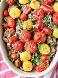Turkey casserole topped with roasted cherry tomatoes