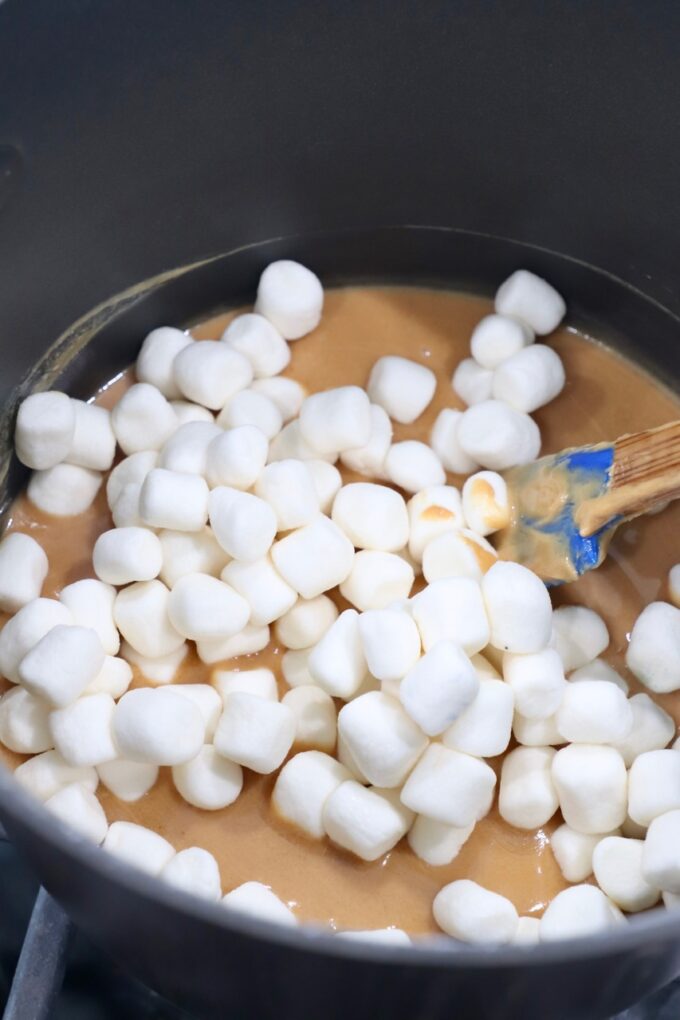 peanut butter cooked down in saucepan with mini marshmallows