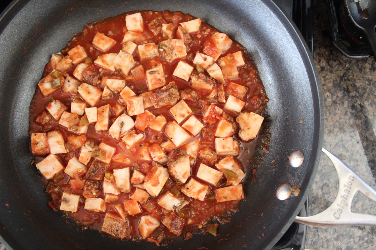 diced cooked turkey in skillet with salsa