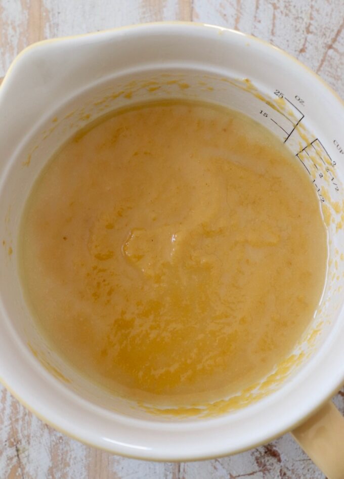 pumpkin puree and melted butter mixed together in bowl