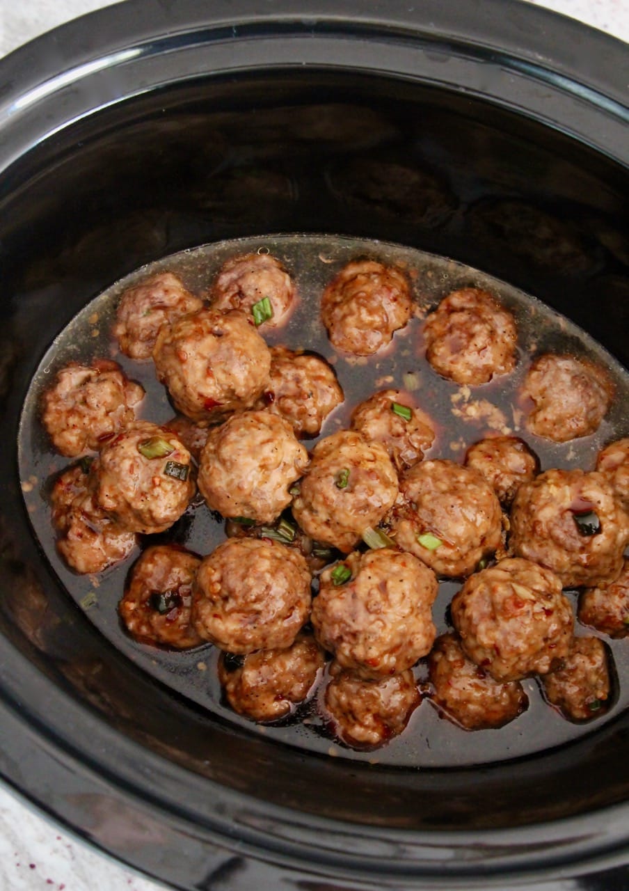 Korean BBQ Meatballs, covered in Korean BBQ sauce in a crock pot