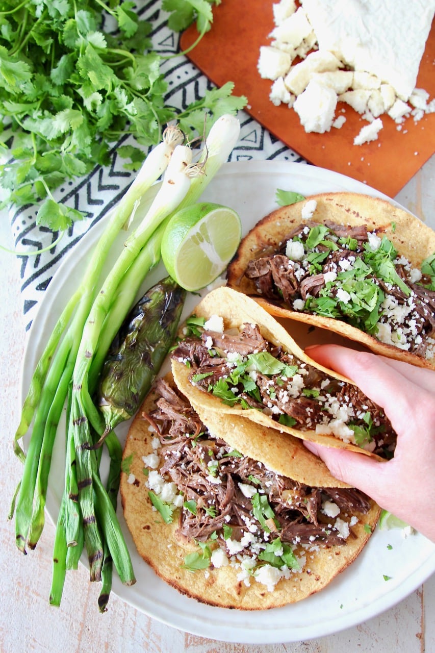 Slow Cooker Beef Barbacoa Tacos with Green Onions and Cilantro