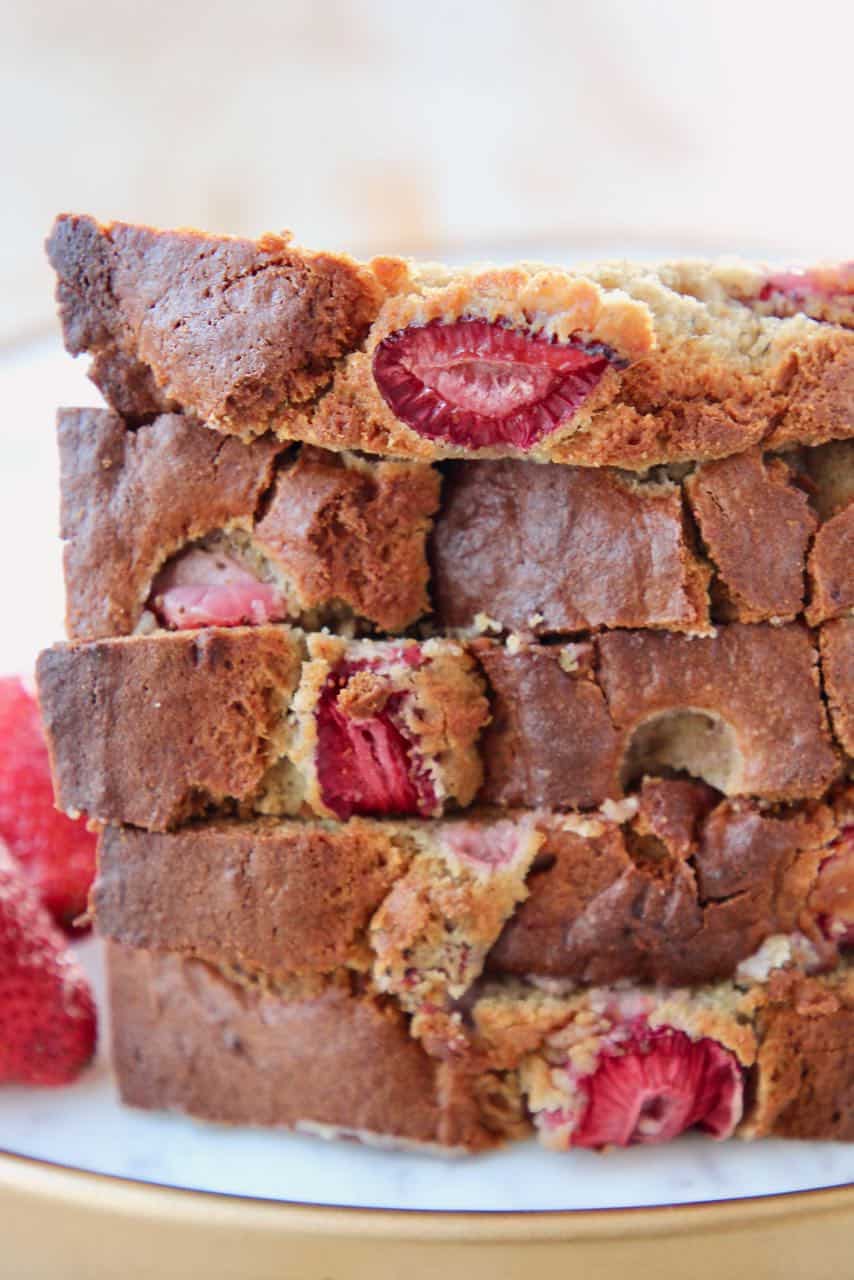 Stacked up pieces of strawberry banana bread