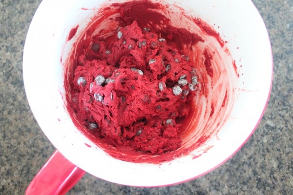 Red velvet chocolate chip cookie dough mixed in a bowl.