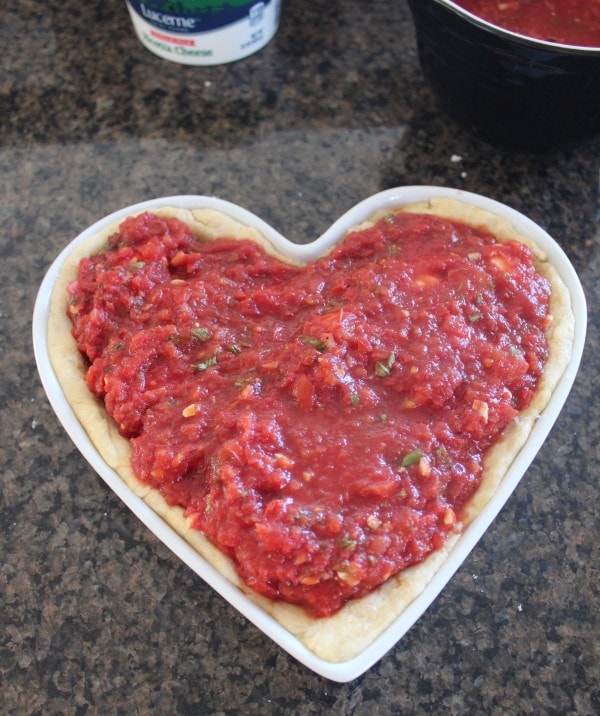 Uncooked Deep Dish Heart Shaped Pizza.