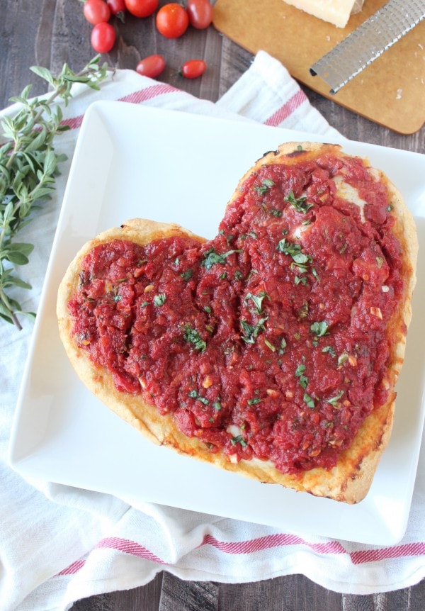 Heart Shaped Pizza on a white plate. 