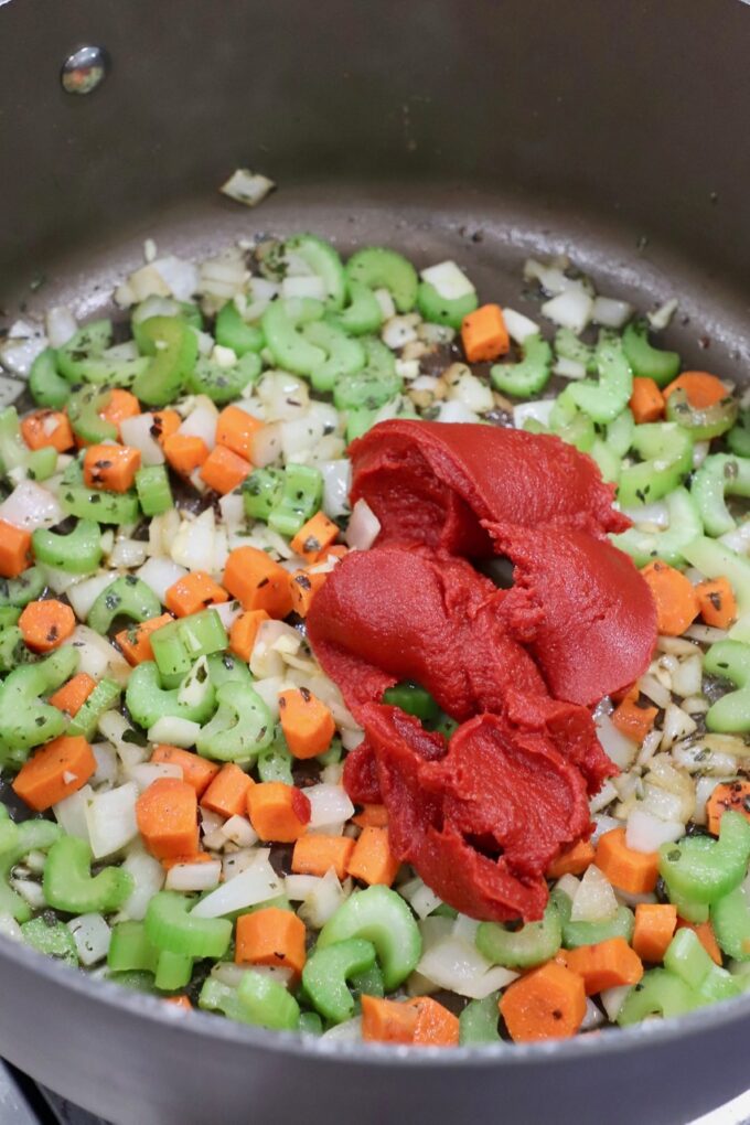 diced vegetables in pot with tomato paste