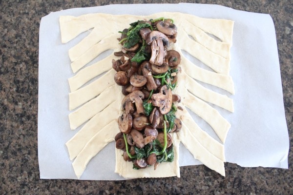 This vegetarian spinach puff pastry recipe is filled with sauteed mushrooms, spinach, and cheddar cheese. Perfect as an appetizer or meatless Monday dinner!