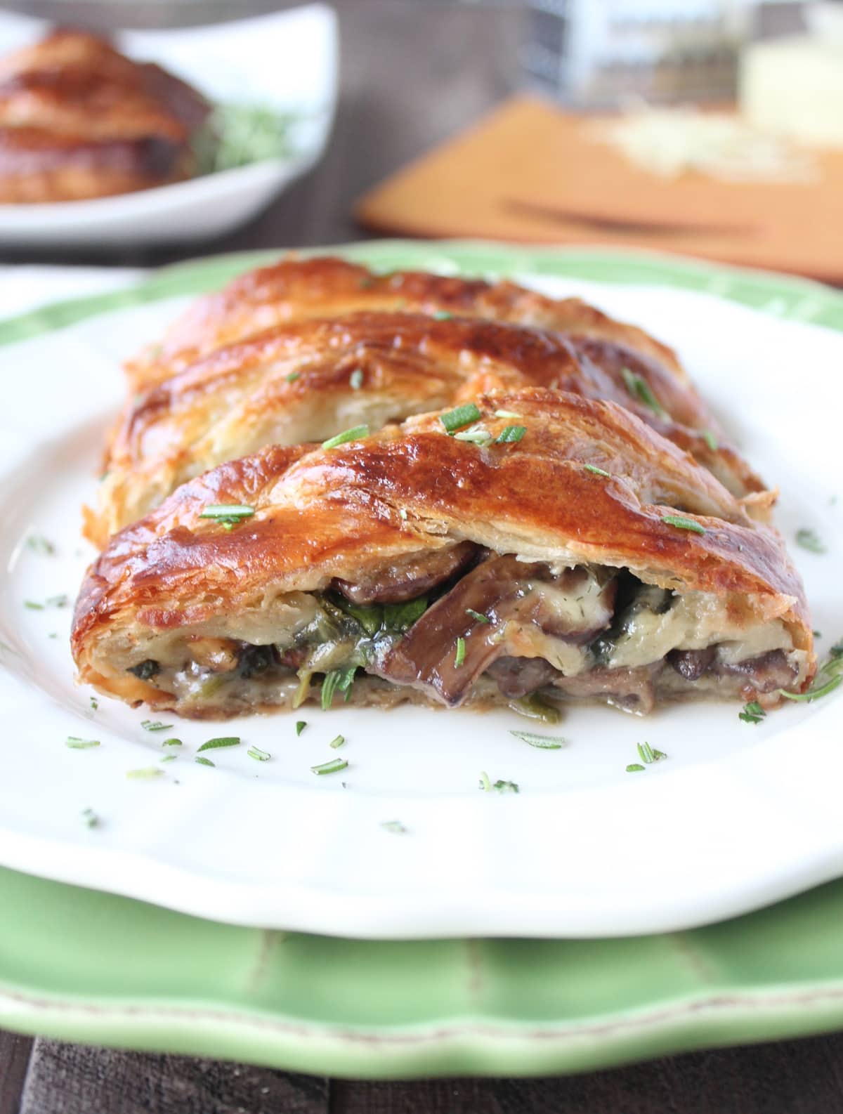 filled puff pastry with cheese, mushrooms and spinach on plate
