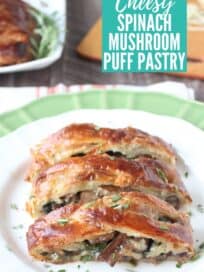 Sliced puff pastry filled with mushrooms and spinach on plate