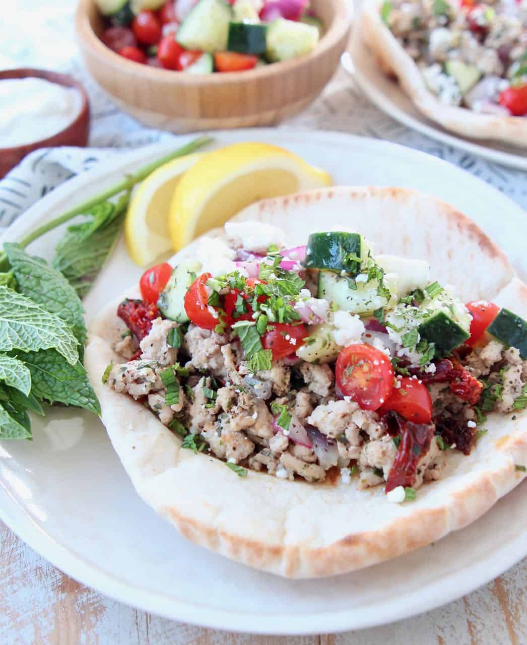 Gyro on plate with ground turkey meat and tomato cucumber salsa