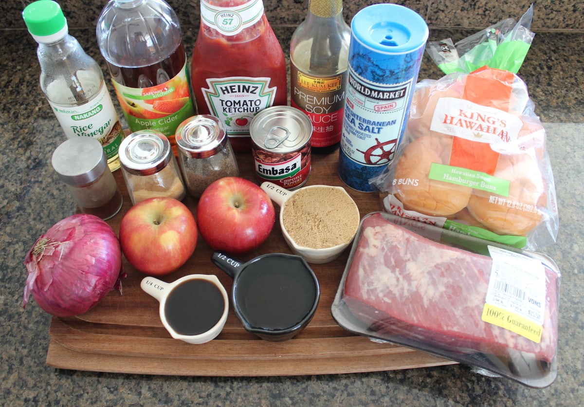 ingredients for bbq brisket sandwiches on a wood board