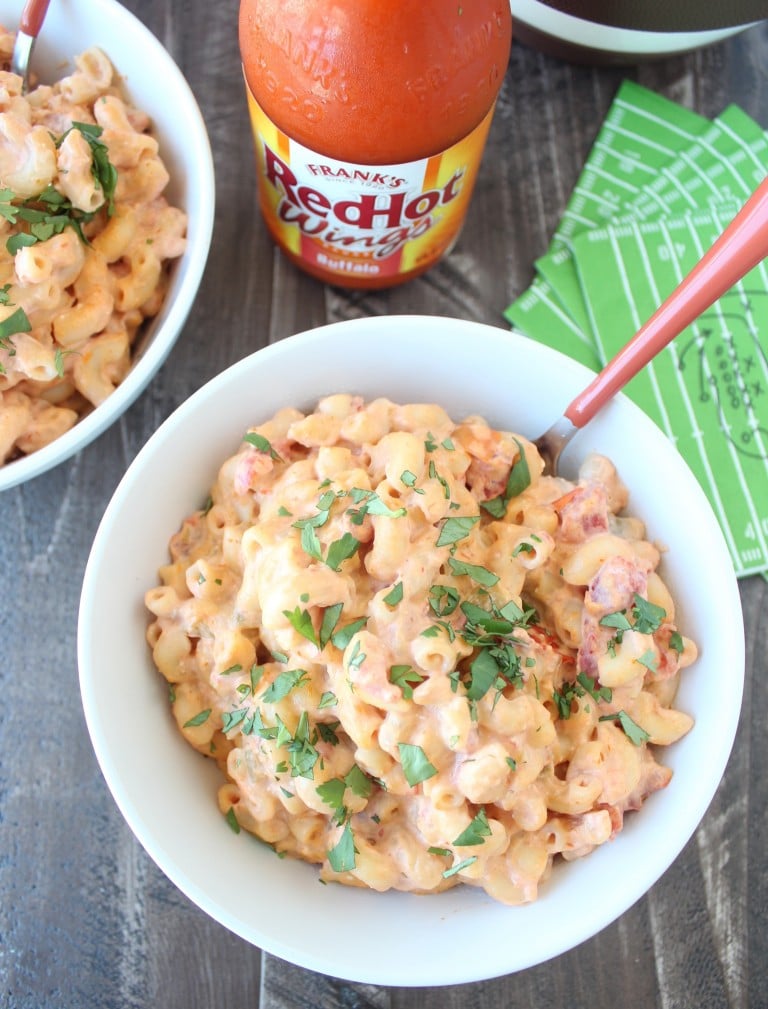 macaroni and cheese in white bowl with orange fork