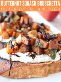 Roasted cubes of butternut squash on slices of bread with ricotta cheese