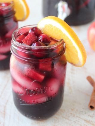 Cranberries and apples give this delicious sangria recipe tons of great fall flavors, mix up a pitcher to celebrate the holidays with friends and family!