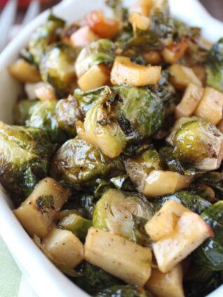 roasted brussels sprouts and diced apples in serving dish