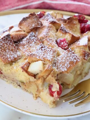 piece of french toast casserole on a plate with a fork