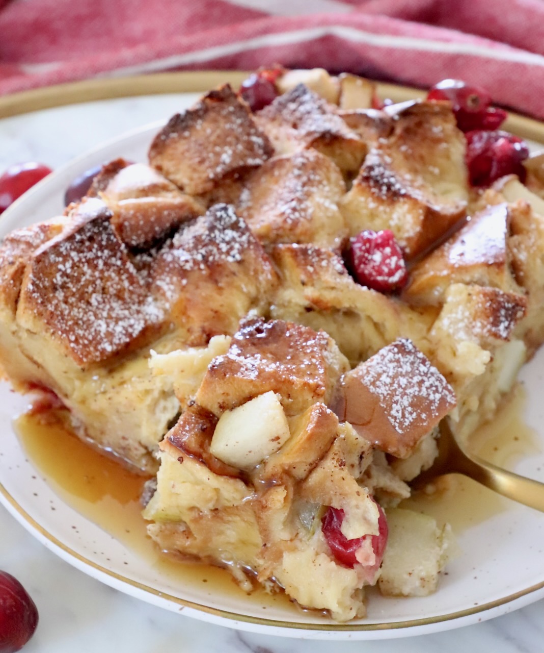 piece of french toast bake on a plate with a fork