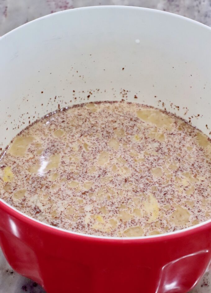 milk, eggs, and cinnamon combined in a large mixing bowl