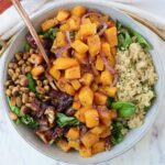 butternut squash salad in a bowl with a fork