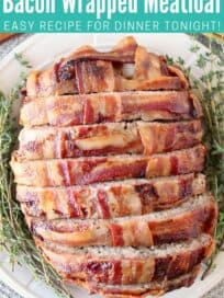 Sliced meatloaf wrapped in bacon on plate