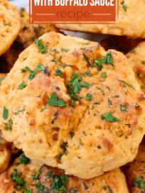 cheddar biscuits stacked up on a plate