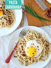 Overhead image of spaghetti on plate topped with egg