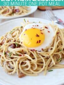 Egg on top of spaghetti on plate
