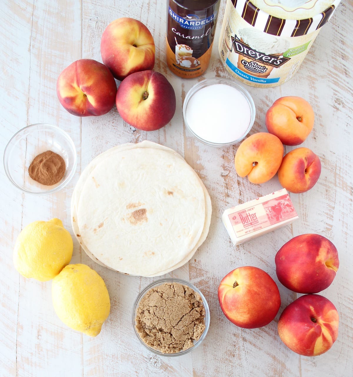 Crock Pot Dessert Fruit Taco Cups Ingredients on a white wood board