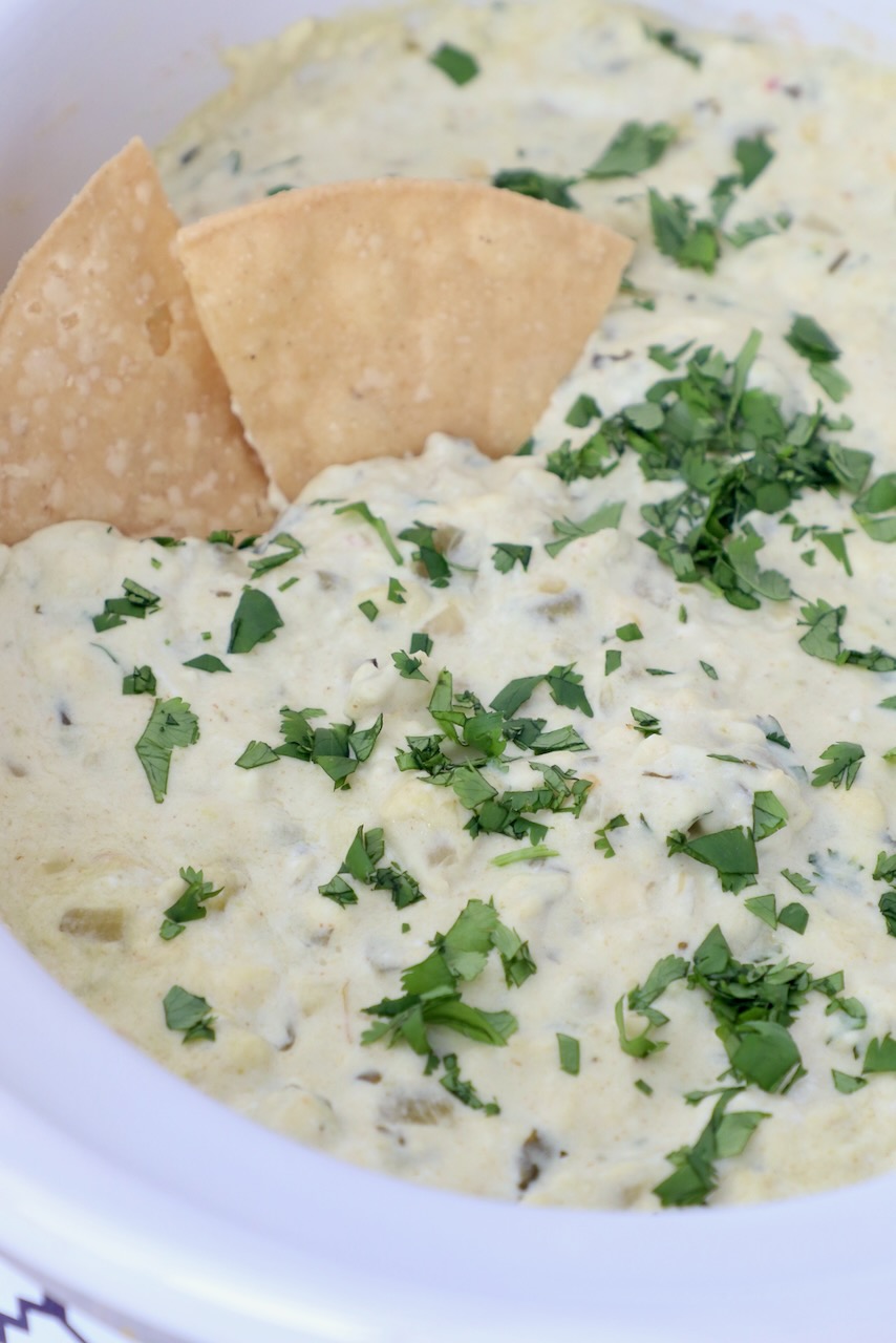 queso blanco dip in slow cooker with tortilla chips