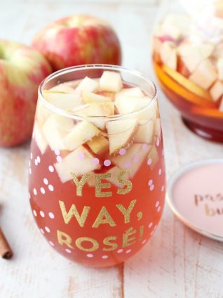 Fall flavors are combined with sparkling rosé in this delicious Honey Apple Sangria Recipe, perfect for holiday parties or a fun girls night in!