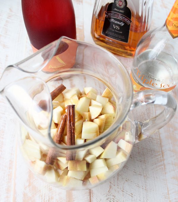 Fall flavors are combined with sparkling rosé in this delicious Honey Apple Sangria Recipe, perfect for holiday parties or a fun girls night in!