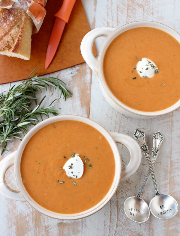 In 30 minutes, make the most delicious, vegetarian sweet potato soup recipe with rosemary roasted sweet potatoes, vegetable broth & a hint of cream!
