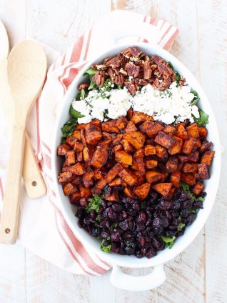 This Chili Roasted Sweet Potato & Cranberry Salad recipe combines sweet, savory & tart ingredients to make the most flavorful vegetarian salad ever!