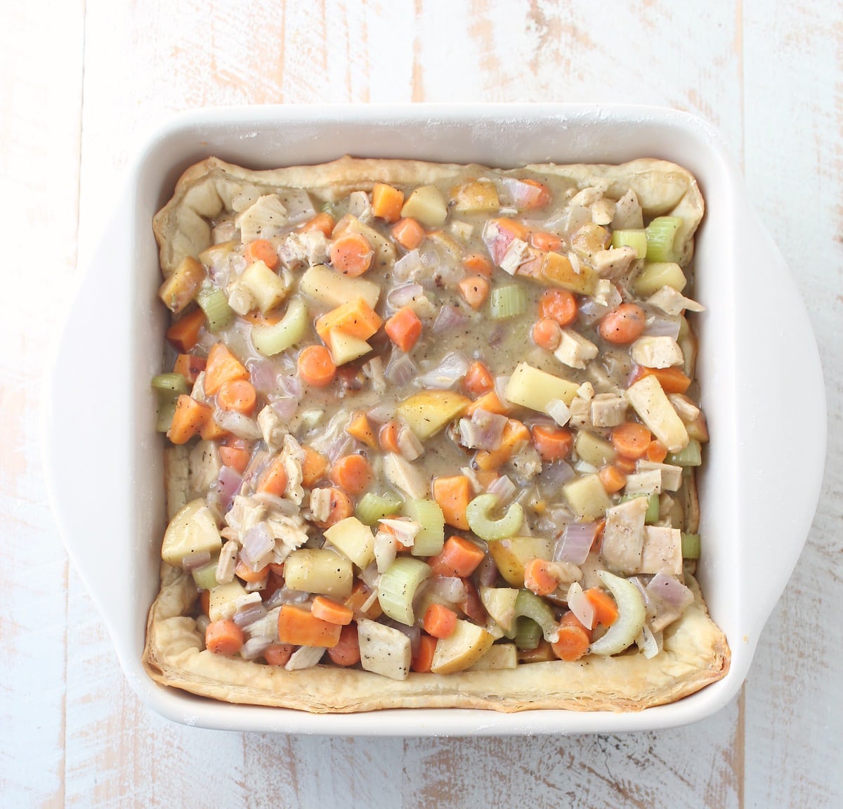Turkey Pot Pie with Puff Pastry Crust is a delicious comfort food recipe anytime of the year, but is perfect for using up leftover turkey from Thanksgiving!