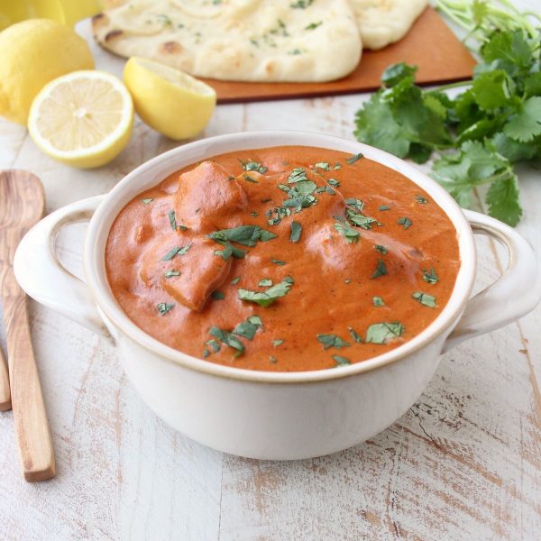 This 30 Minute Indian Butter Chicken recipe is a quick & easy twist on a classic Indian dish that's perfect served with cilantro rice & garlic naan!