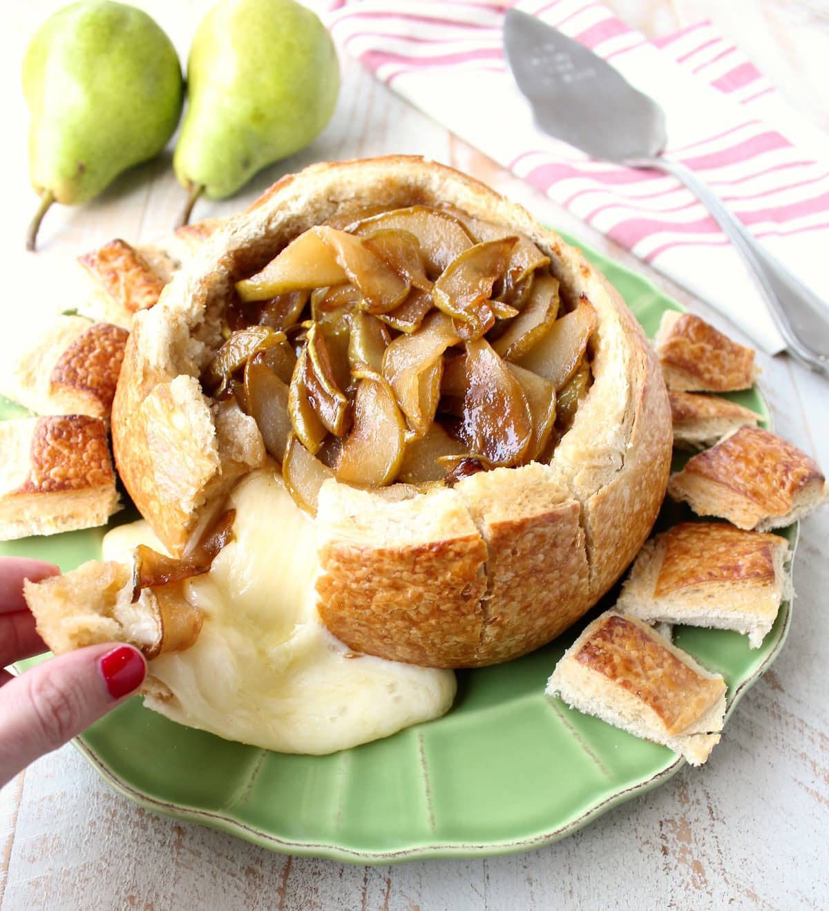 Caramelized Pear Baked Brie Bread Bowl with Fresh Pears and Toasted Pieces of Sourdough Bread