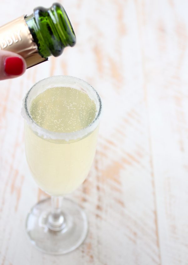 Disney's famous Pineapple Whip is turned into a delicious fizz cocktail in this simple 3-ingredient drink recipe, perfect for any special occasion!