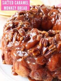 Monkey bread on plate, topped with caramel and pecans