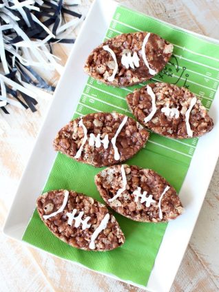 Nutella Rice Krispie Treats are a deliciously easy dessert, make them football shaped for game day parties or Superbowl Sunday!