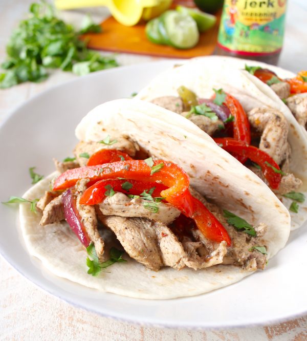 Give your chicken fajitas a taste of the Caribbean with this tasty recipe for Jerk Chicken Fajitas, made in only 20 minutes for an easy weeknight dinner!