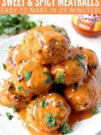 Meatballs covered in buffalo sauce stacked up on plate