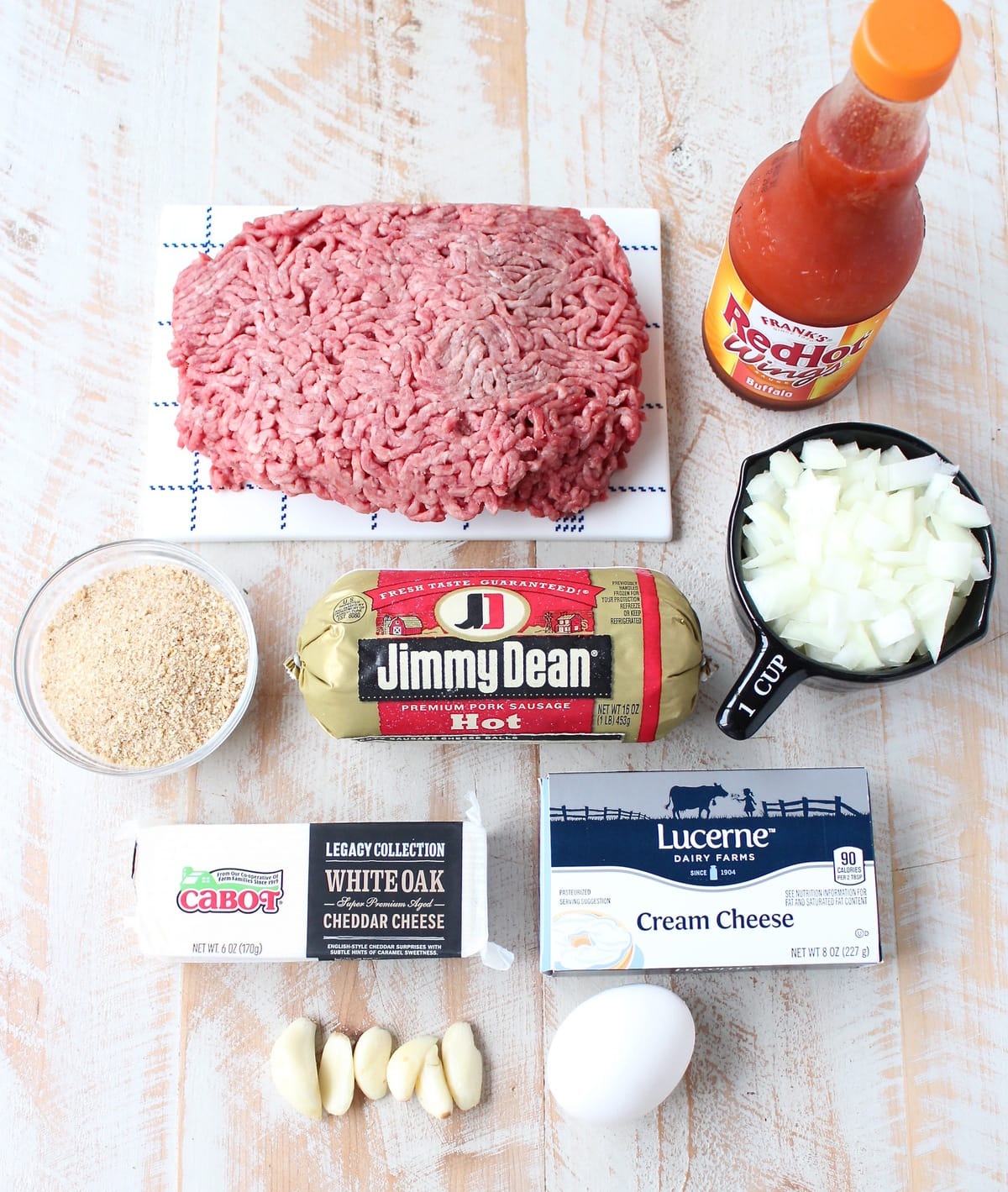 ingredients for buffalo cheesy meatloaf on white wood board