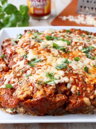 Buffalo sauce, ground beef, pork sausage and two cheeses are combined in this delicious, easy Buffalo Cheesy Meatloaf recipe!