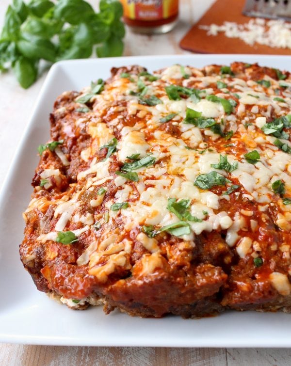 Buffalo sauce, ground beef, pork sausage and two cheeses are combined in this delicious, easy Buffalo Cheesy Meatloaf recipe!