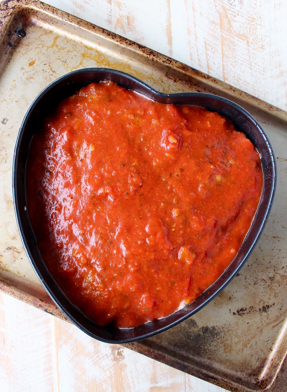 This Italian Meatloaf recipe is easy to make & so delicious! It can be made into a heart shape for Valentine's Day, or made anytime of the year using a traditional meatloaf pan!