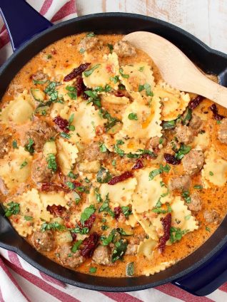 One Pot Pasta Sausage Pesto and Cheese Ravioli is an absolutely mouth watering, delicious recipe that is so easy to make in only 20 minutes!