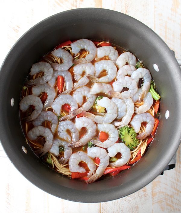 Teriyaki shrimp, fresh veggies and lo mein noodles are combined in this easy one pot recipe, made in under 30 minutes, perfect for weeknight dinners!