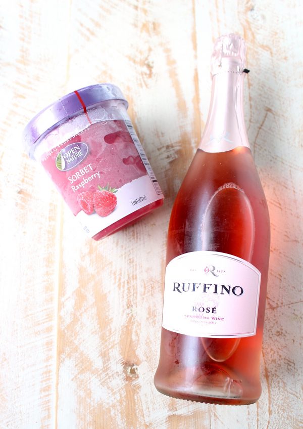 Raspberry sorbet topped with bubbly rosé makes for a deliciously sweet and beautiful pink cocktail, perfect for happy hour, cocktail hour or dessert!