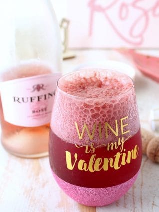 Raspberry sorbet topped with bubbly rosé makes for a deliciously sweet and beautiful pink cocktail, perfect for happy hour, cocktail hour or dessert!